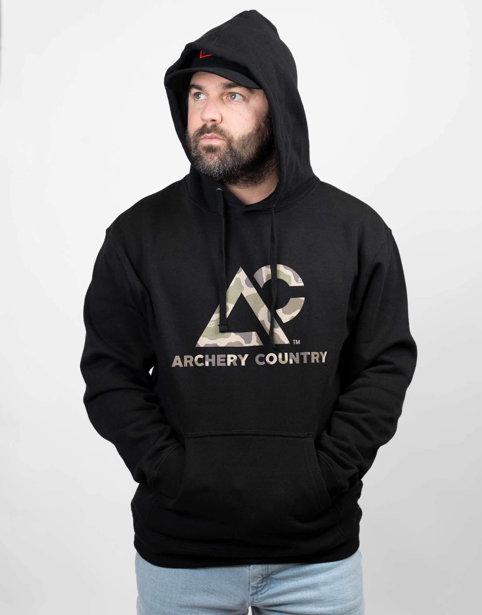 Man wearing a black hoodie with 'Archery Country' logo in camo