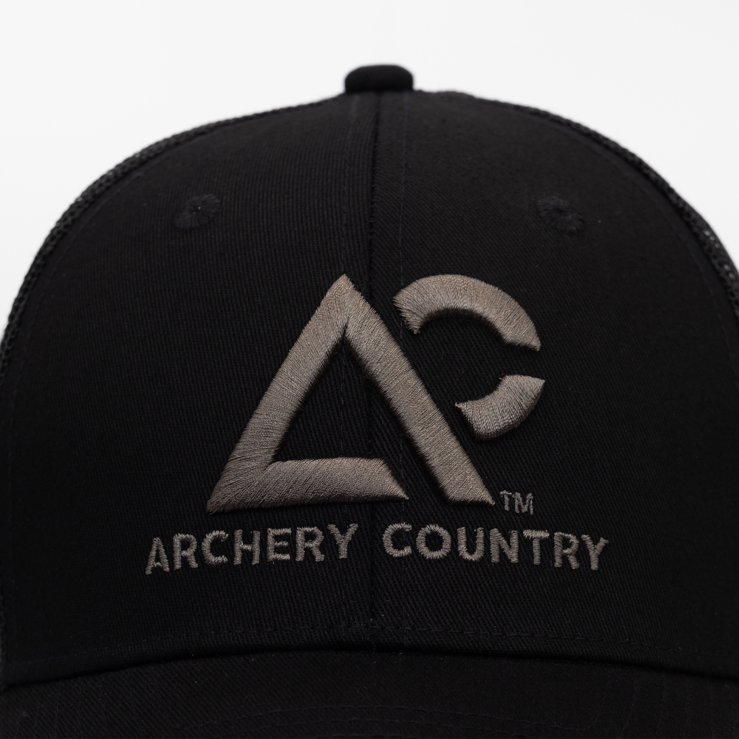 closeup of black cap with "ARCHERY COUNTRY" logo on front