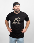 Man wearing black tee with camo "ARCHERY COUNTRY" logo on chest