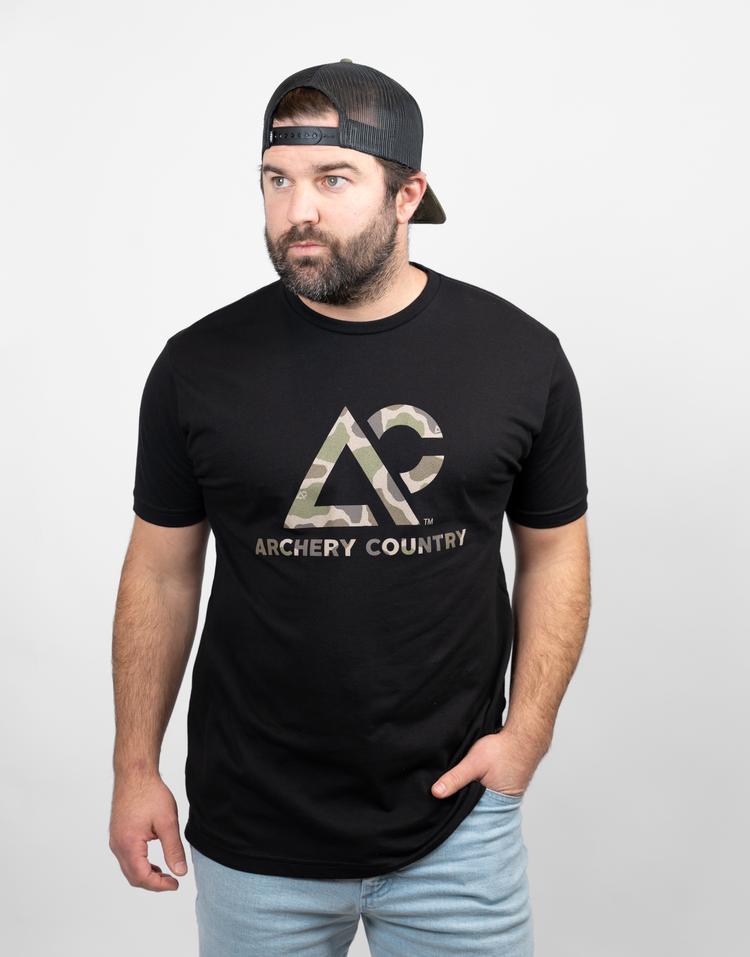 Man wearing black tee with camo "ARCHERY COUNTRY" logo on chest