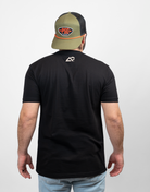 rear view of man in black tee with small Archery Country logo on upper back