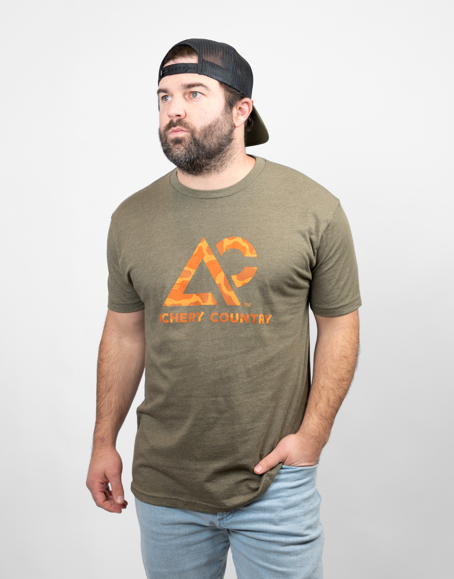 Man wearing military green tee with camo "ARCHERY COUNTRY" logo on chest