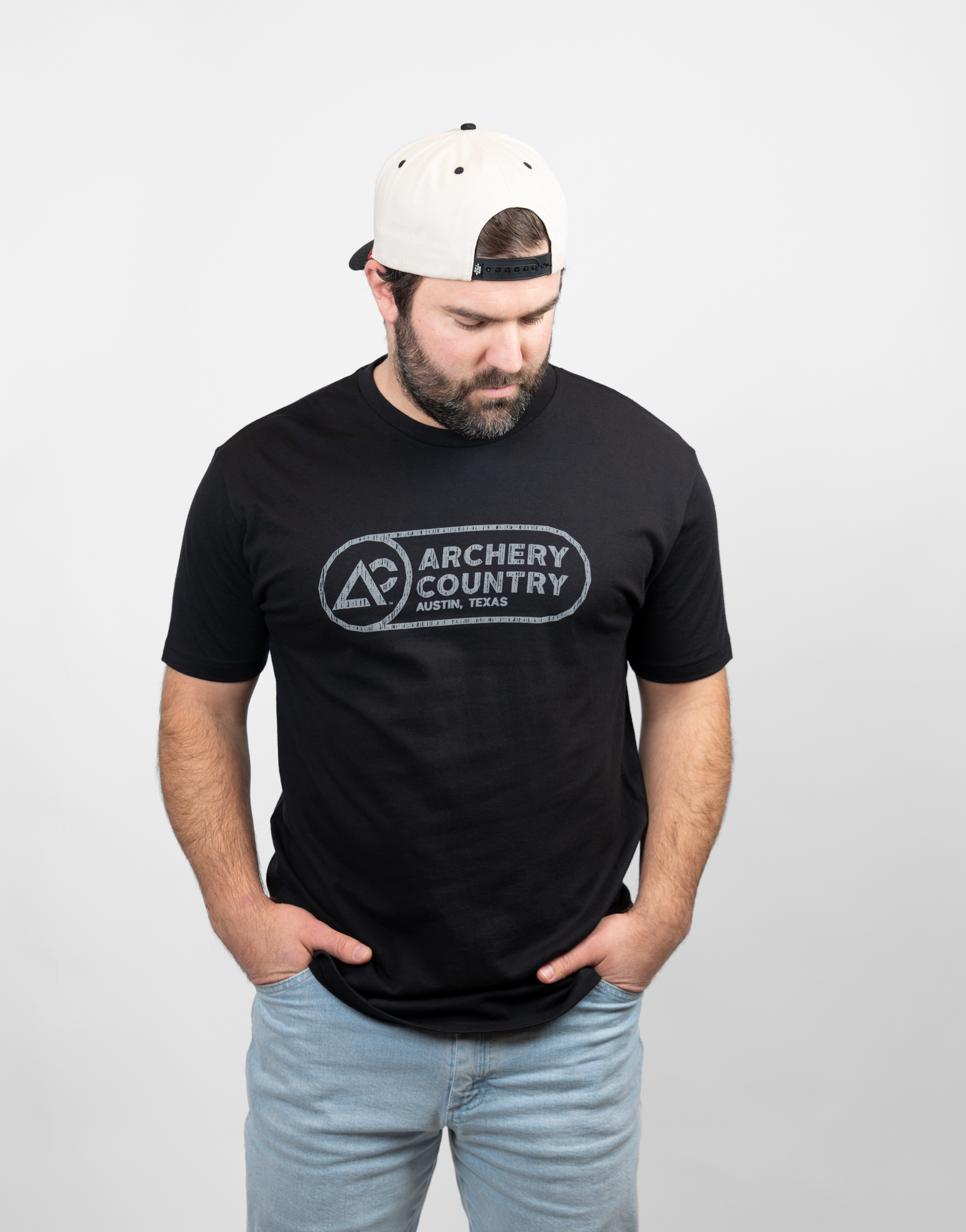 Man wearing a black t-shirt with 'Archery Country' logo on a white background