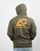 Man wearing Green hoodie with Orange 'Archery Country' logo on the back