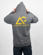 Person wearing a charcoal hoodie with 'Archery Country' logo on the back, standing against a plain background.
