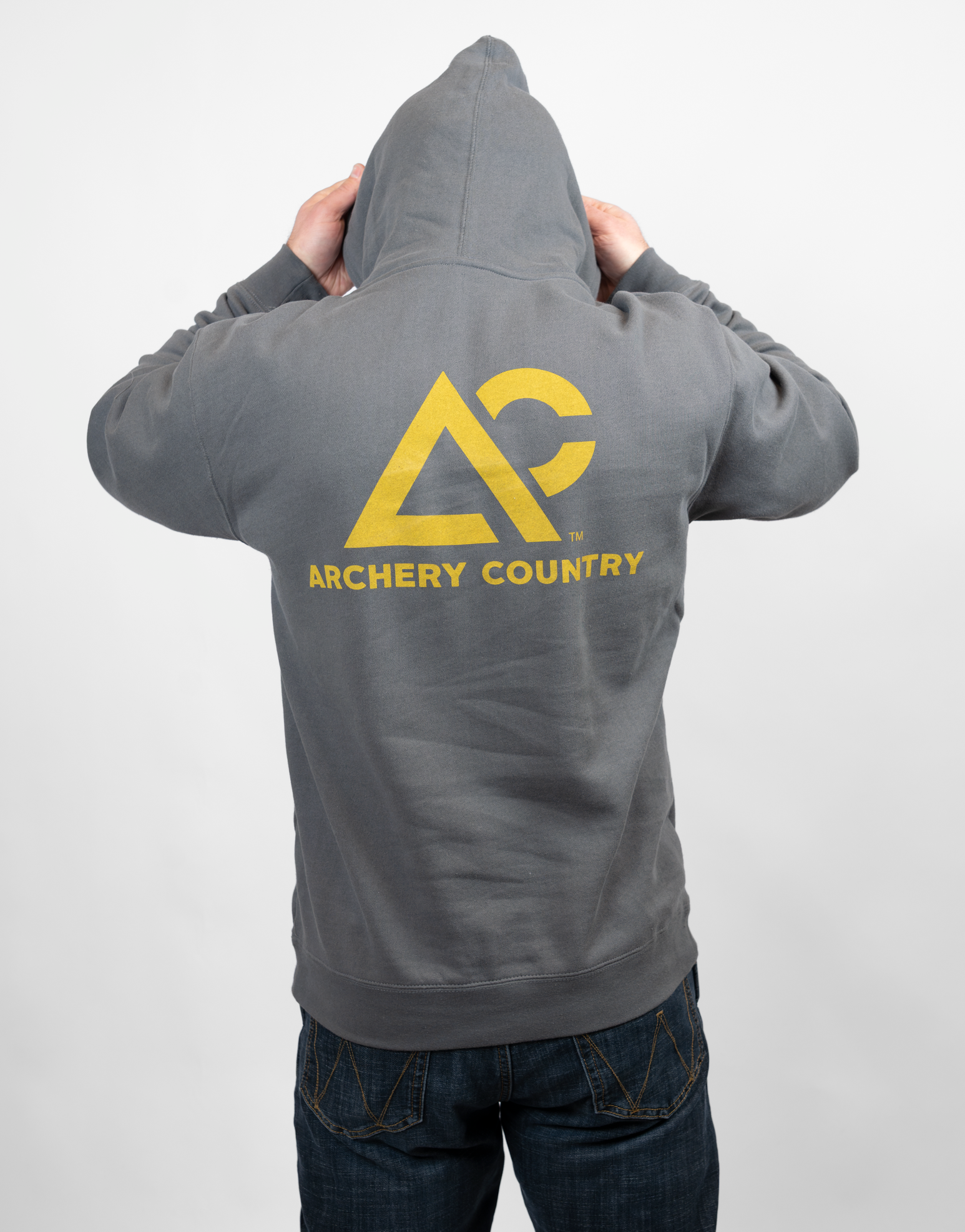 Person wearing a charcoal hoodie with 'Archery Country' logo on the back, standing against a plain background.