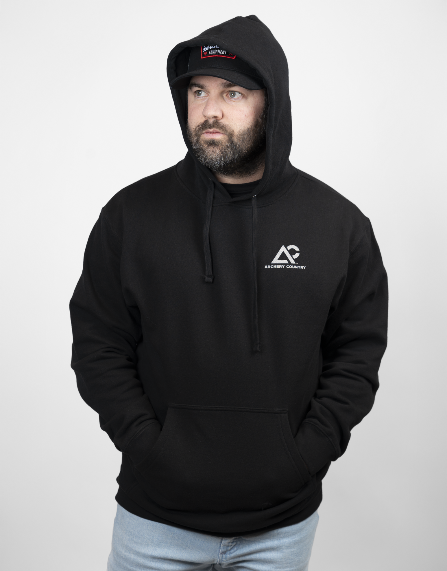 Man wearing black hoodie with Archery Country logo on left chest