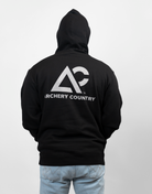 man wearing black hoodie with large Archery Country logo on back