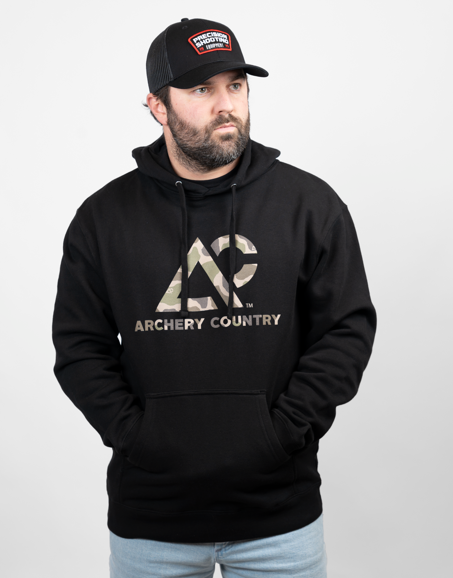 Man wearing a black hoodie with 'Archery Country' logo in camo